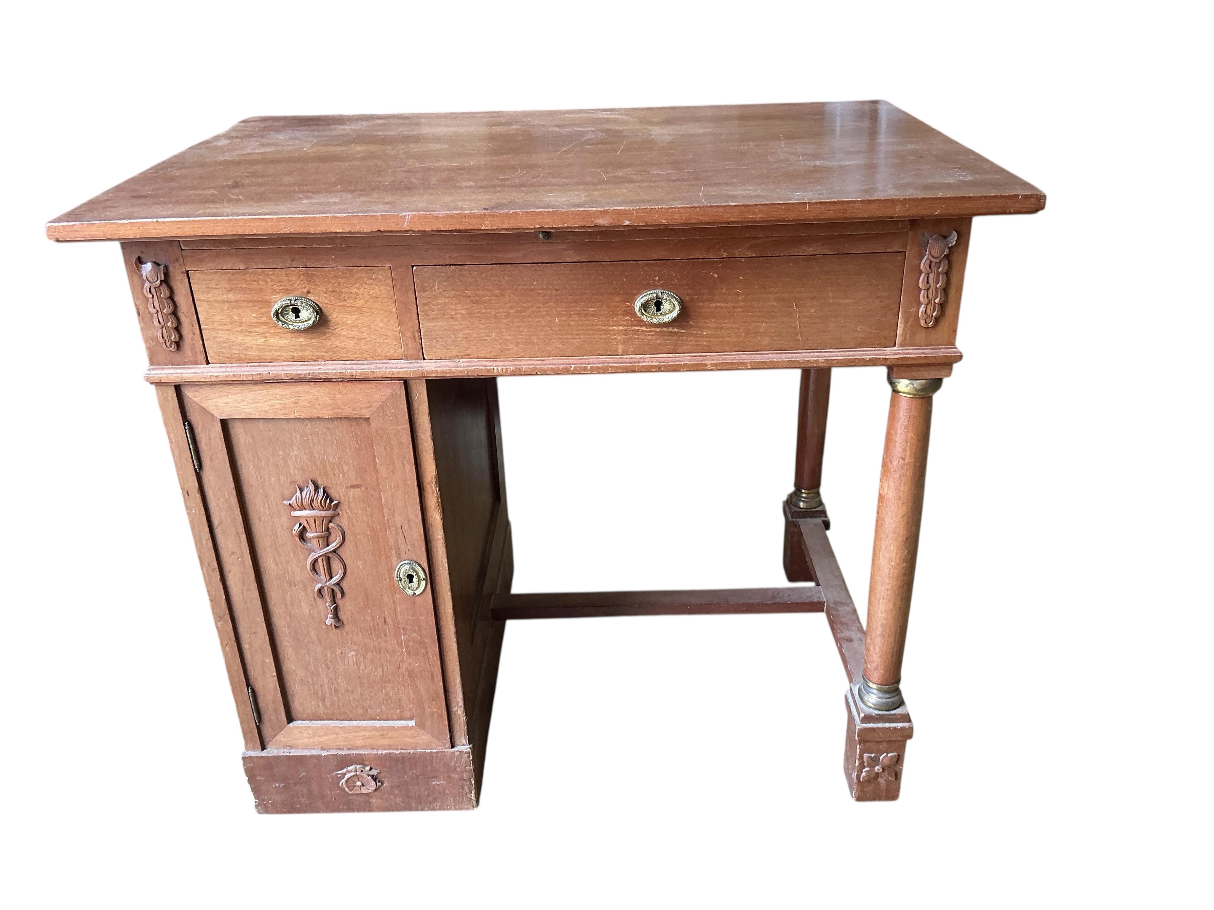 A French Empire style mahogany kneehole dressing table, width 90cm, depth 60cm, height 77cm